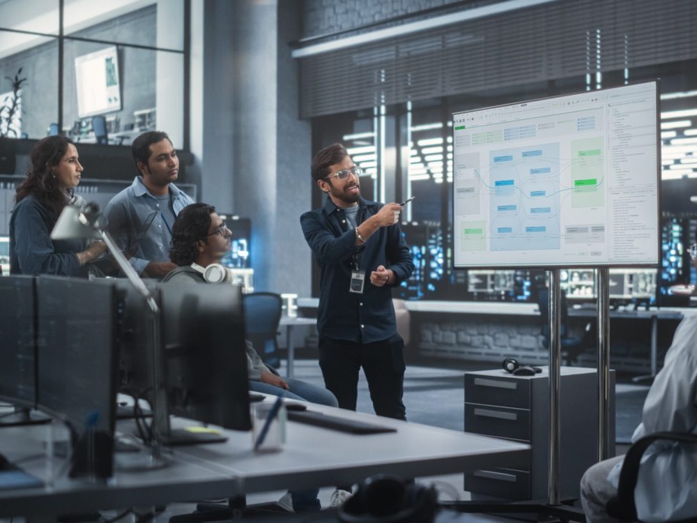 Team,Of,Multiethnic,Indian,Software,Engineers,Having,A,Meeting,In